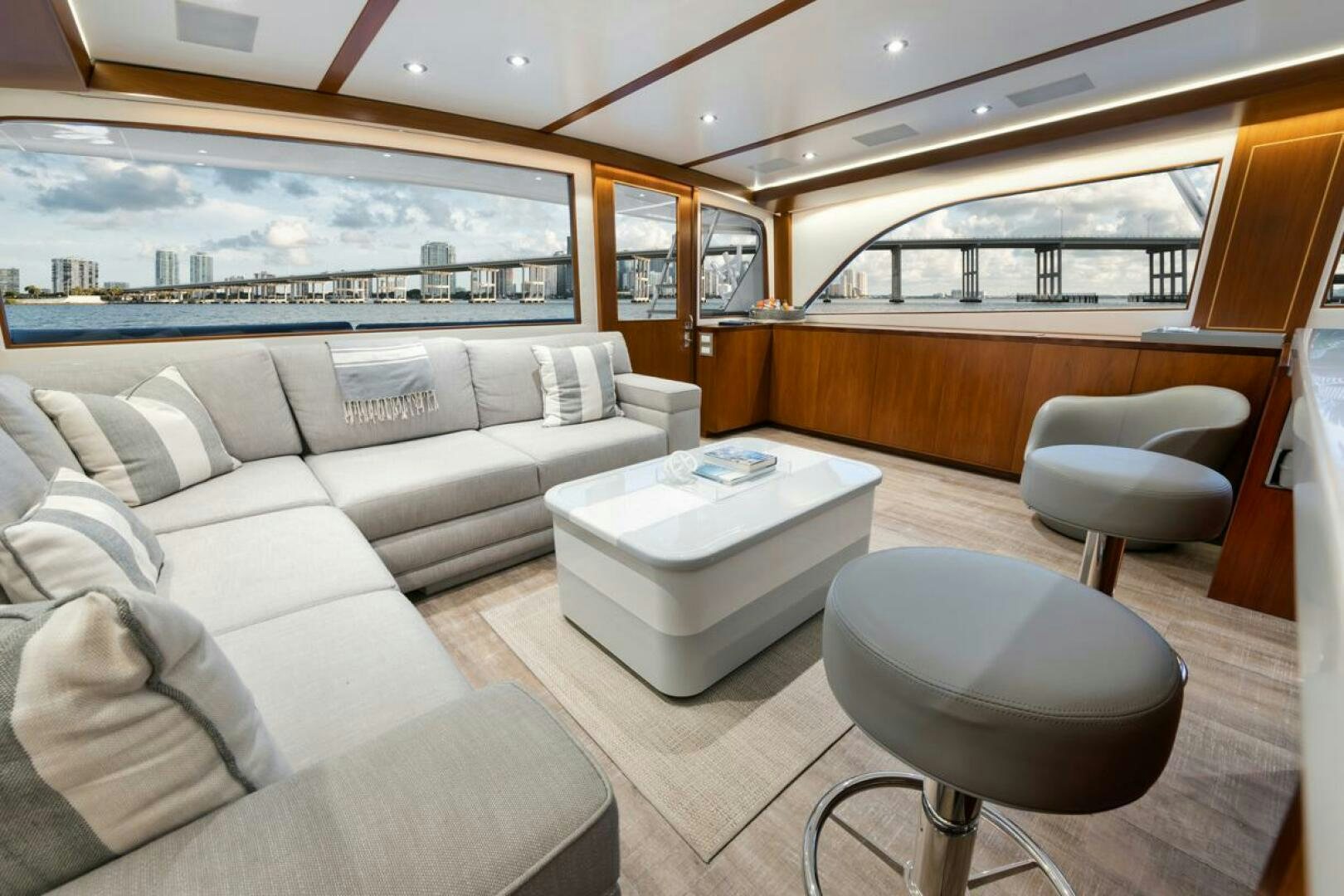 a living room with a couch and a table aboard BOXER Yacht for Sale