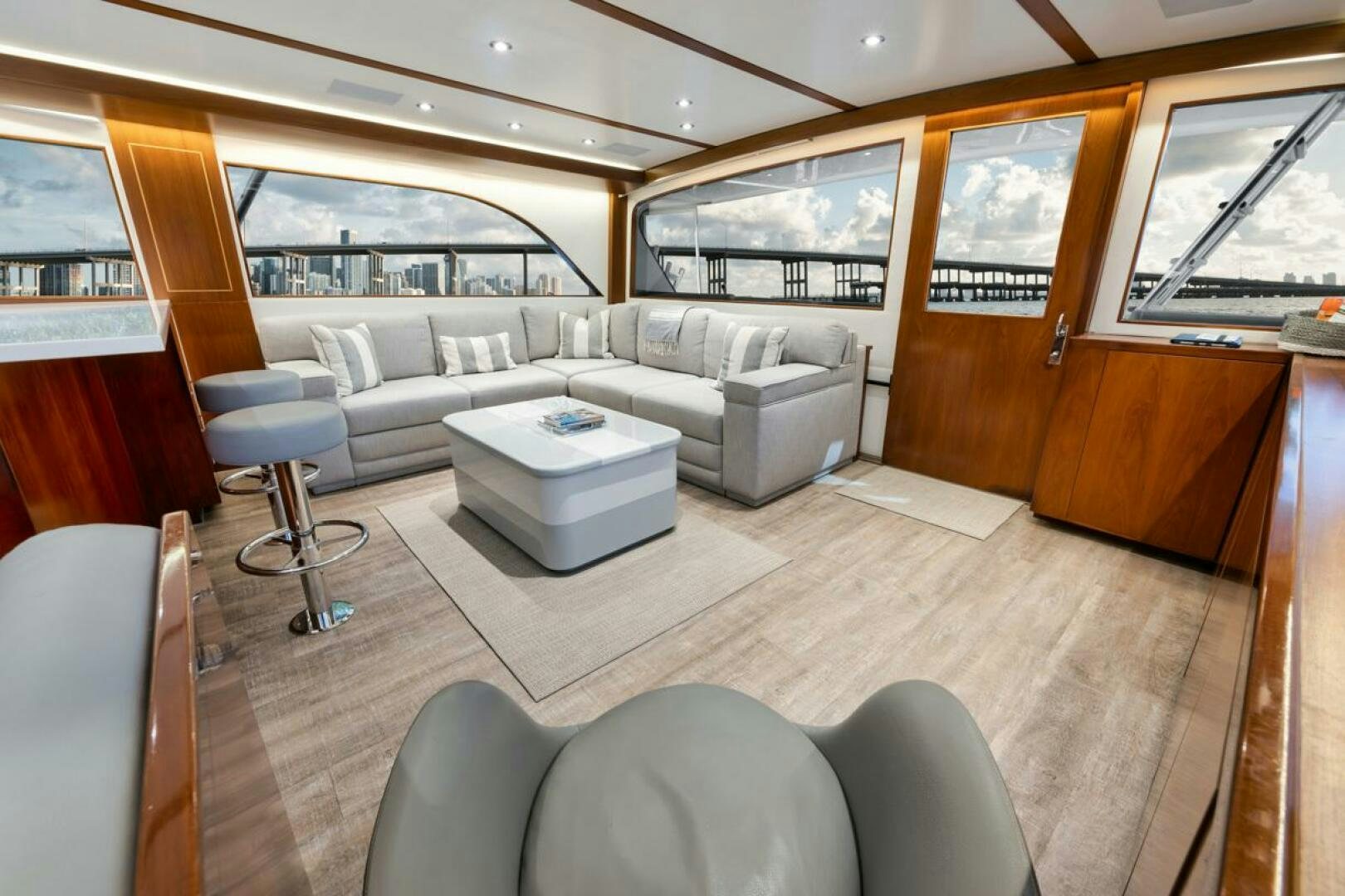 a living room with a couch and a table aboard BOXER Yacht for Sale