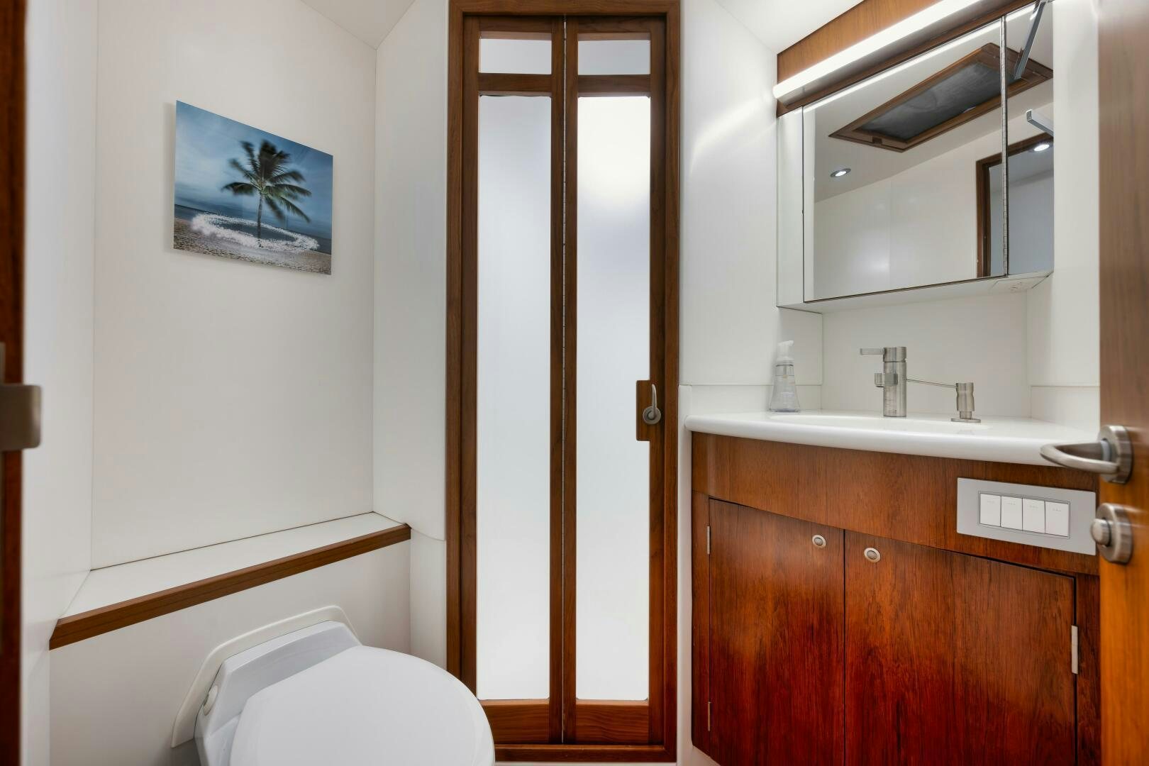 a bathroom with a toilet and a sink aboard BOXER Yacht for Sale