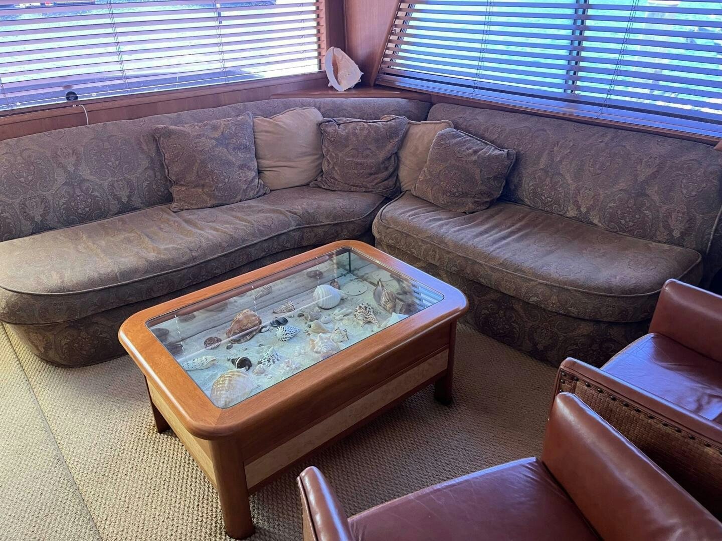 a couch with a coffee table aboard LADY T Yacht for Sale