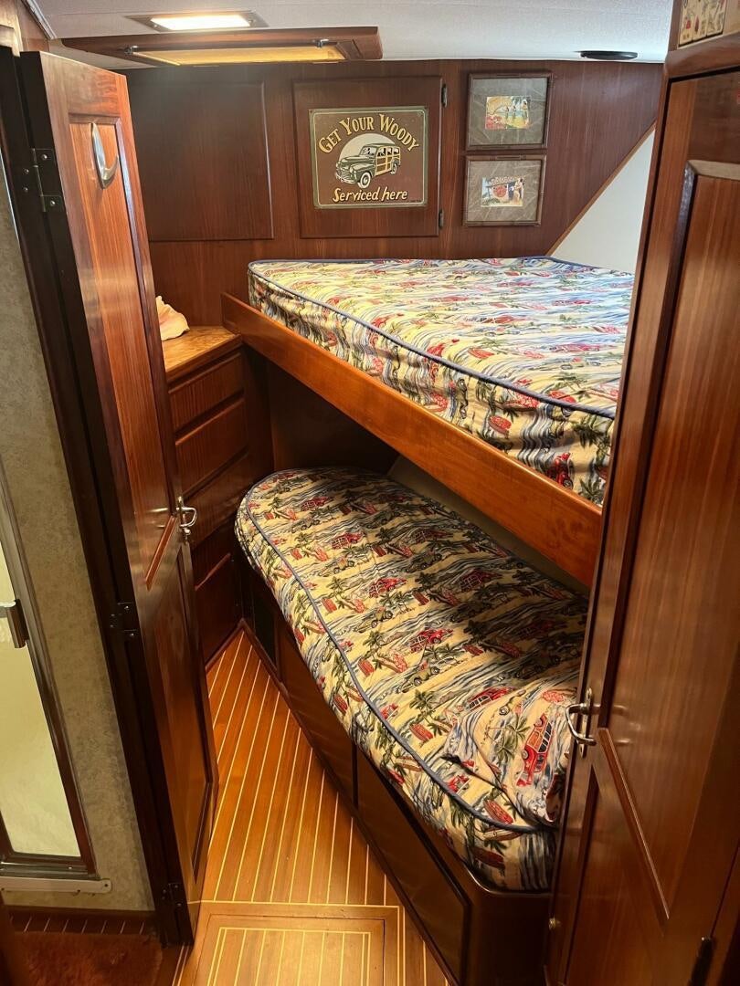 a bed in a room aboard LADY T Yacht for Sale