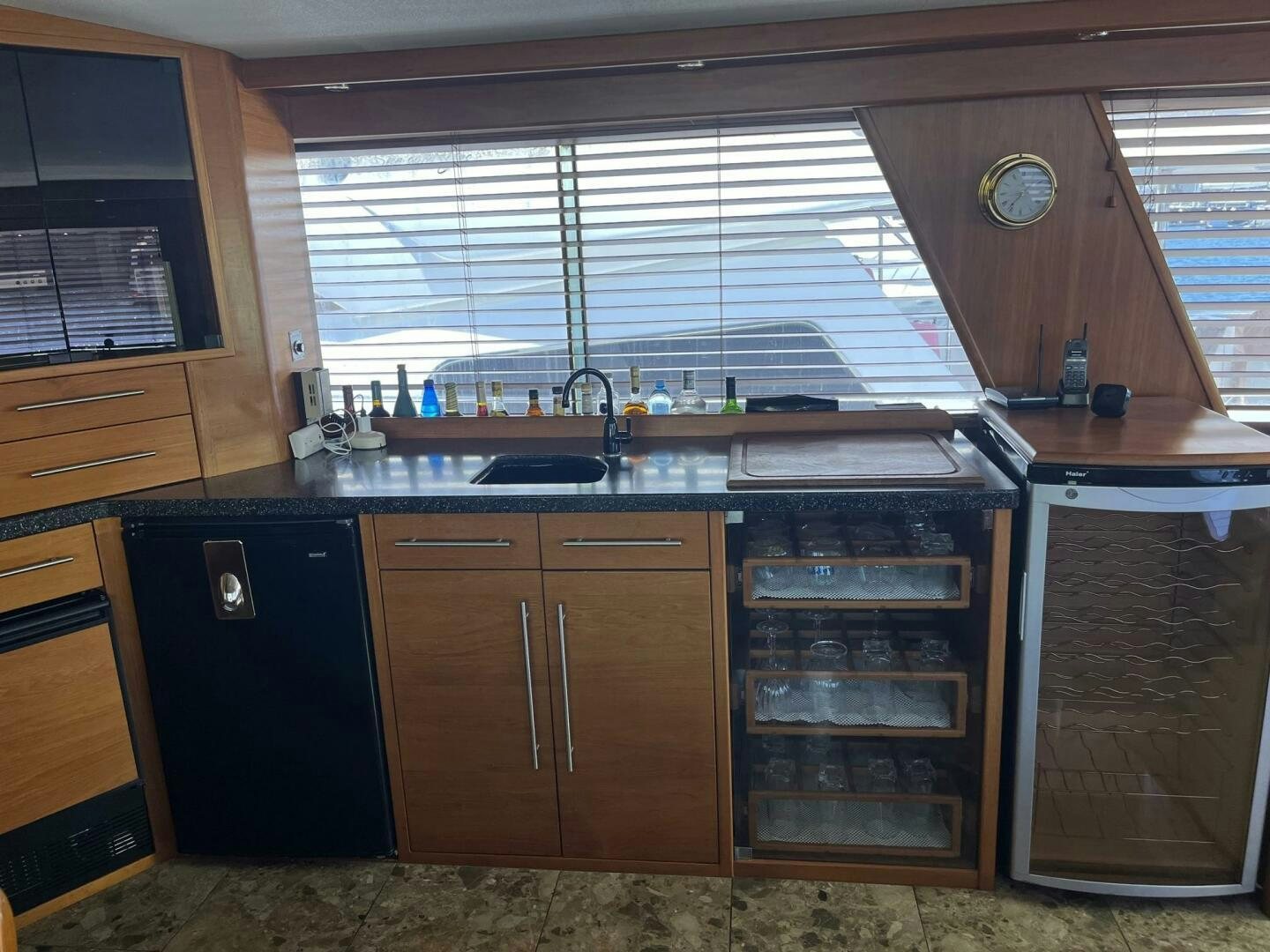 a kitchen with wooden cabinets aboard LADY T Yacht for Sale