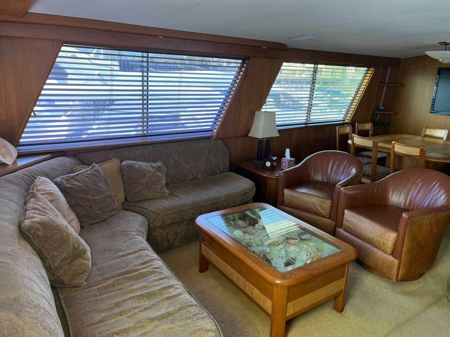 a living room with a couch and a coffee table aboard LADY T Yacht for Sale