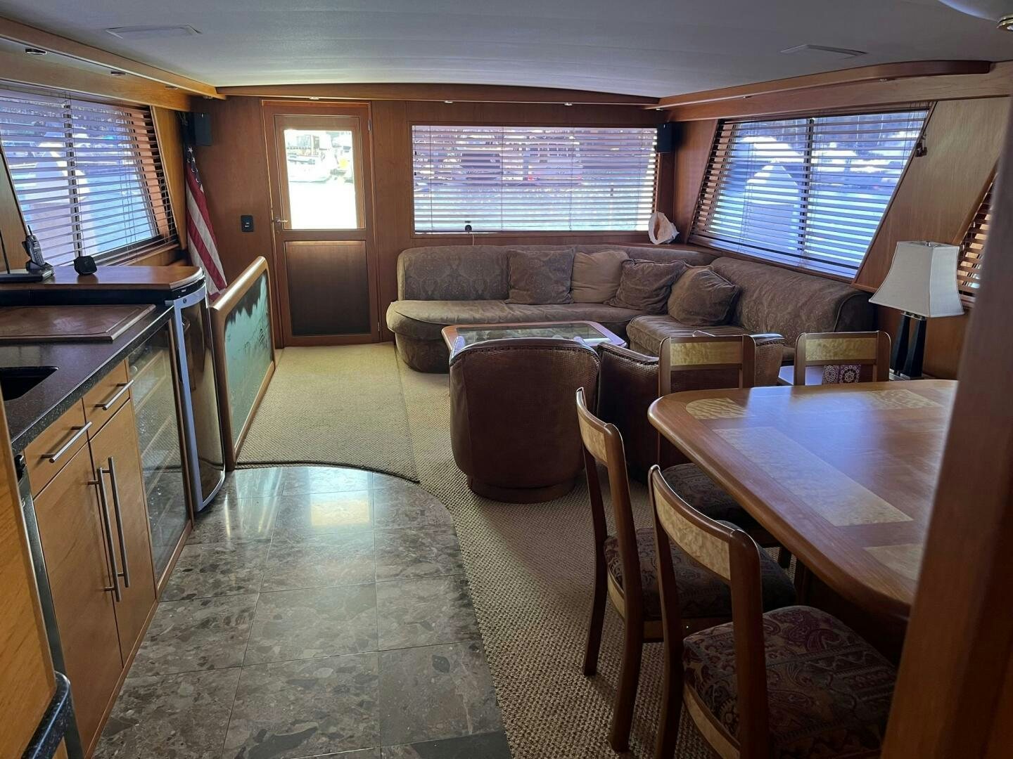 a living room with a couch and a table aboard LADY T Yacht for Sale