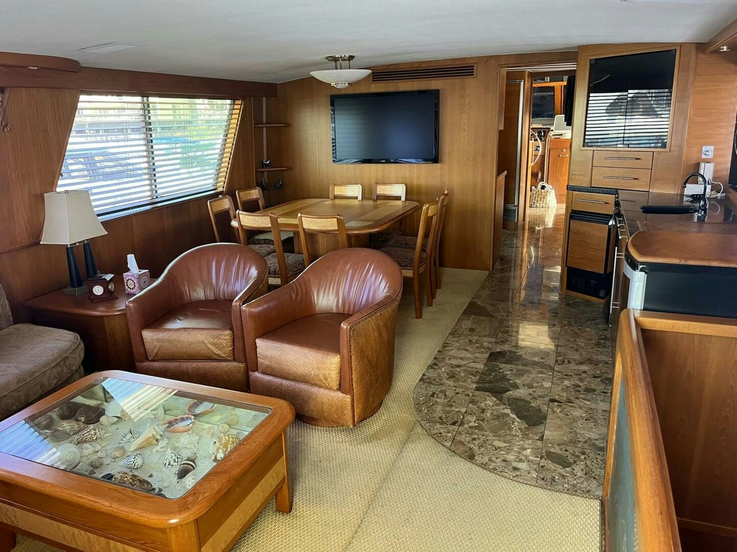 a living room with a large mirror aboard LADY T Yacht for Sale
