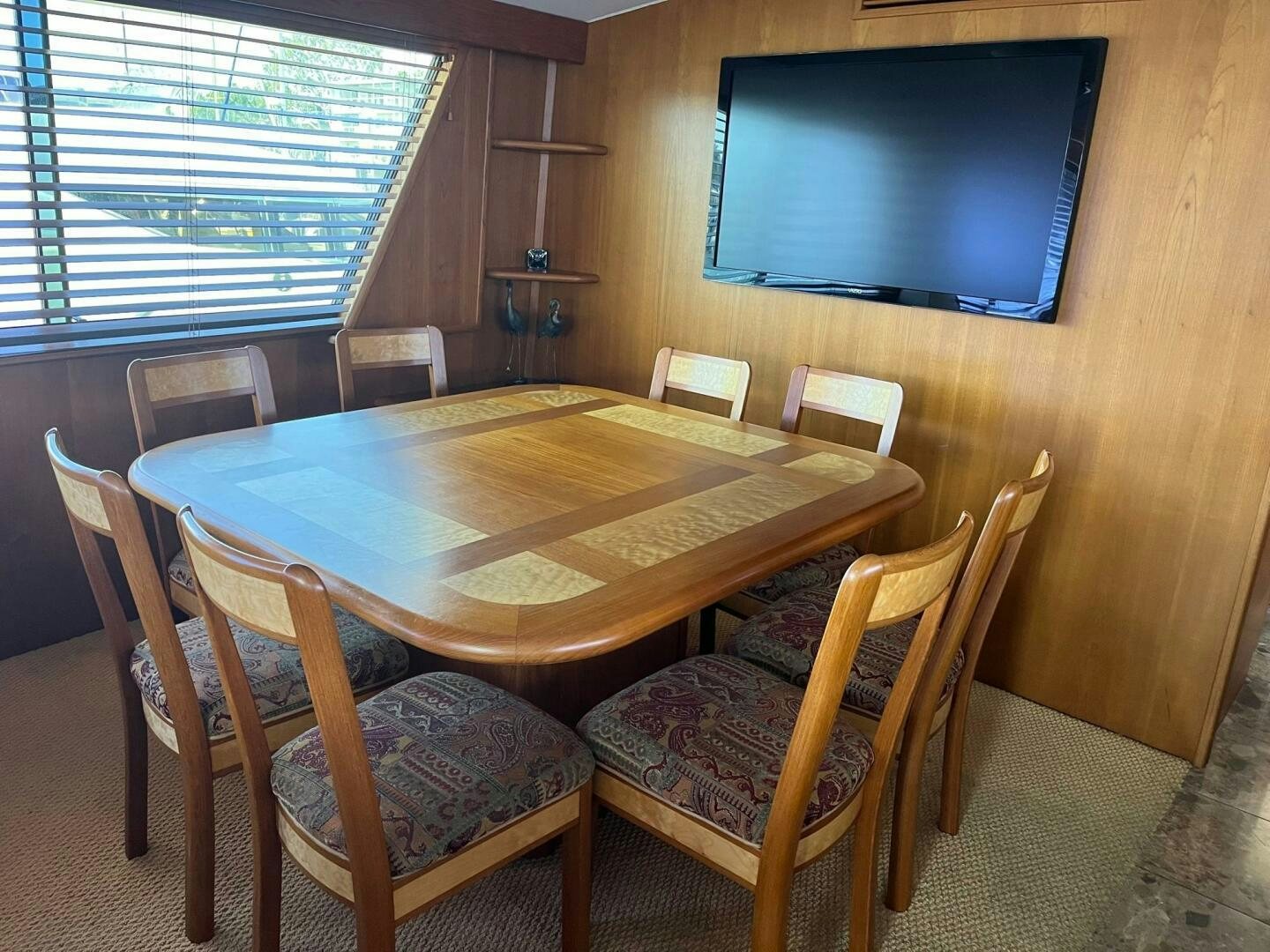 a table with chairs around it aboard LADY T Yacht for Sale