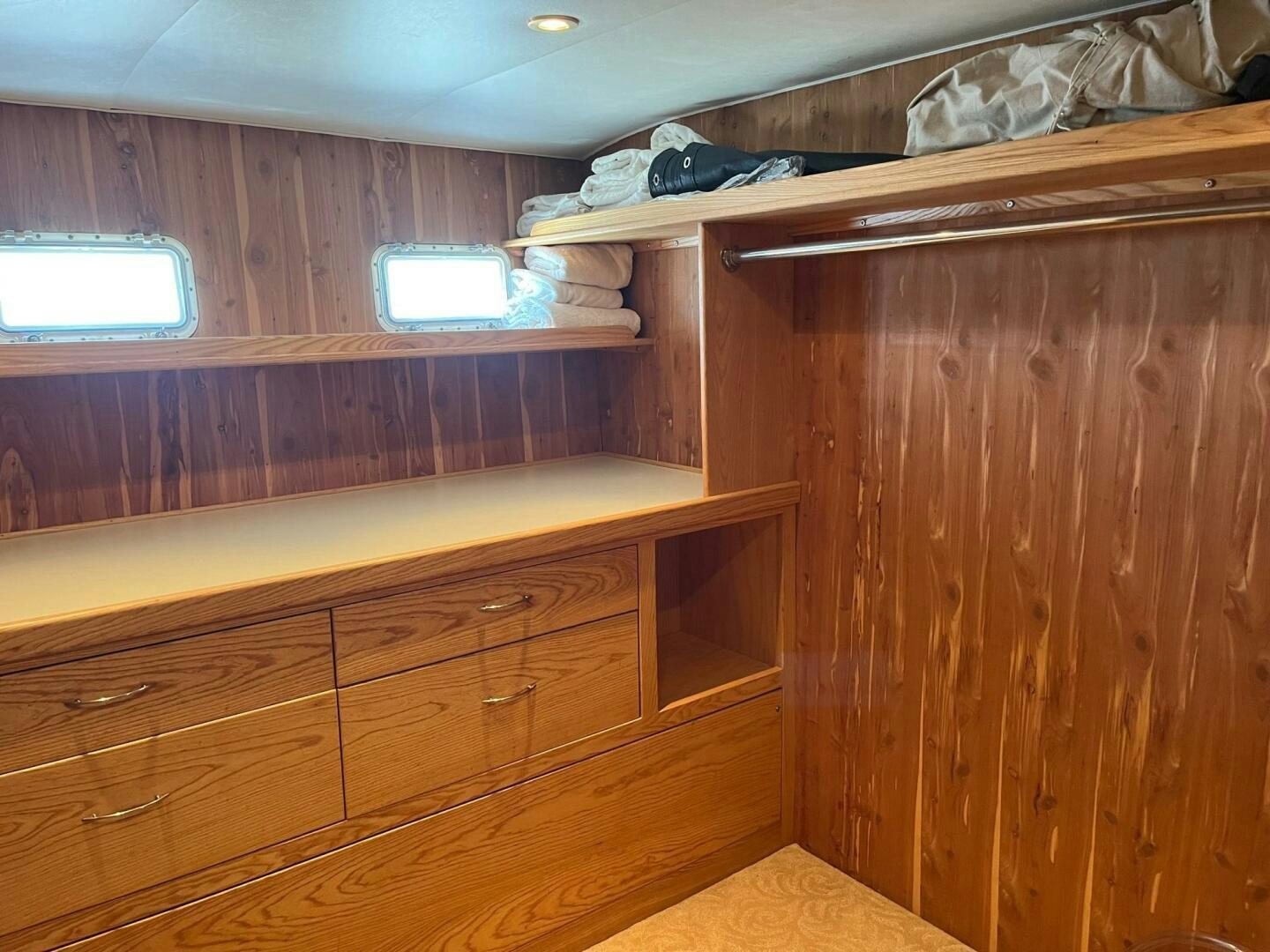 a room with wooden cabinets aboard LADY T Yacht for Sale