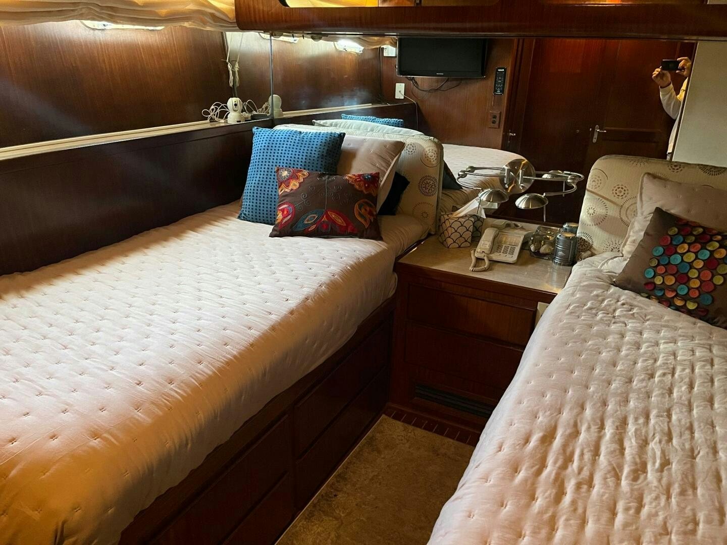 a room with a bed and a couple of beds aboard LADY T Yacht for Sale