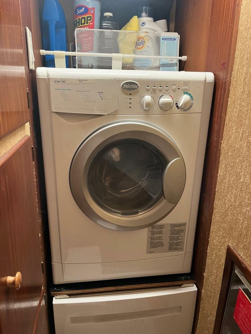 a washing machine in a kitchen aboard LADY T Yacht for Sale