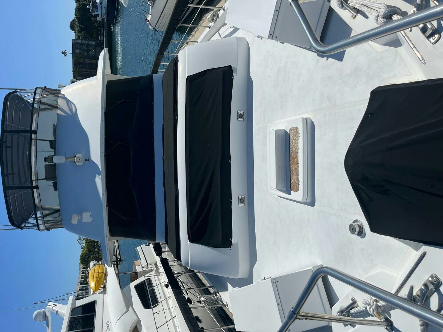 a white boat with black windows aboard LADY T Yacht for Sale