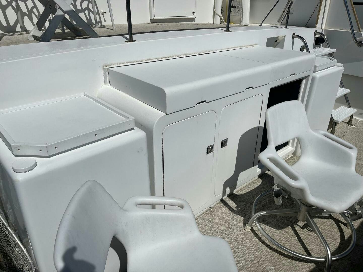 a white machine with a chair aboard LADY T Yacht for Sale