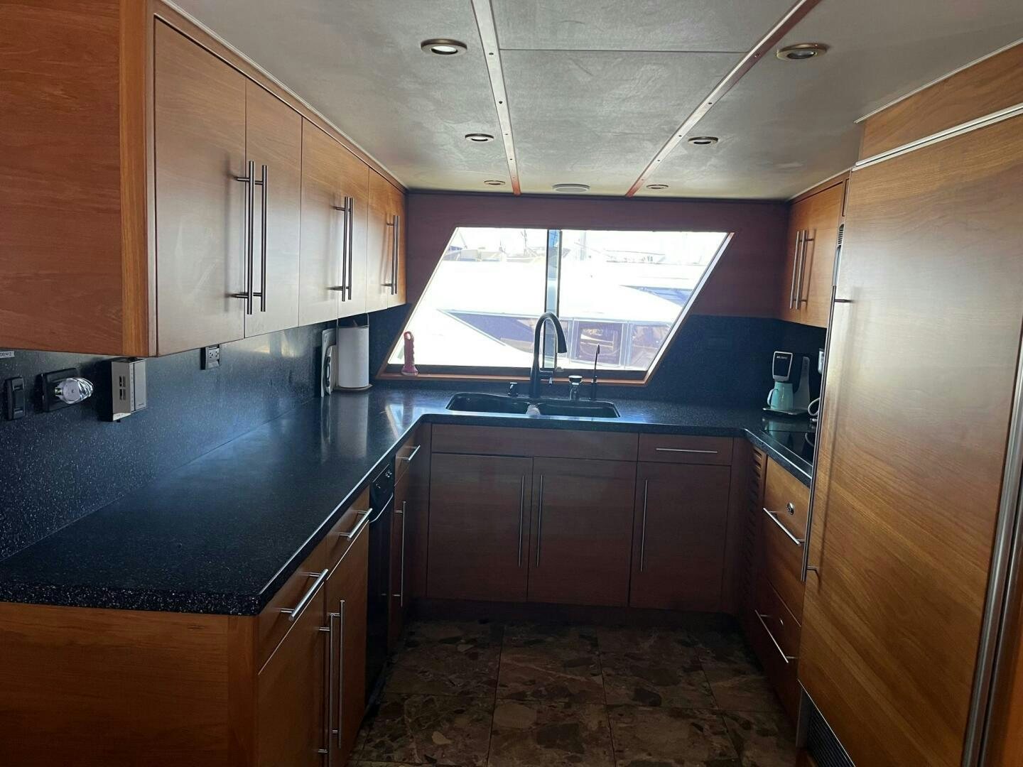 a kitchen with a sink and cabinets aboard LADY T Yacht for Sale