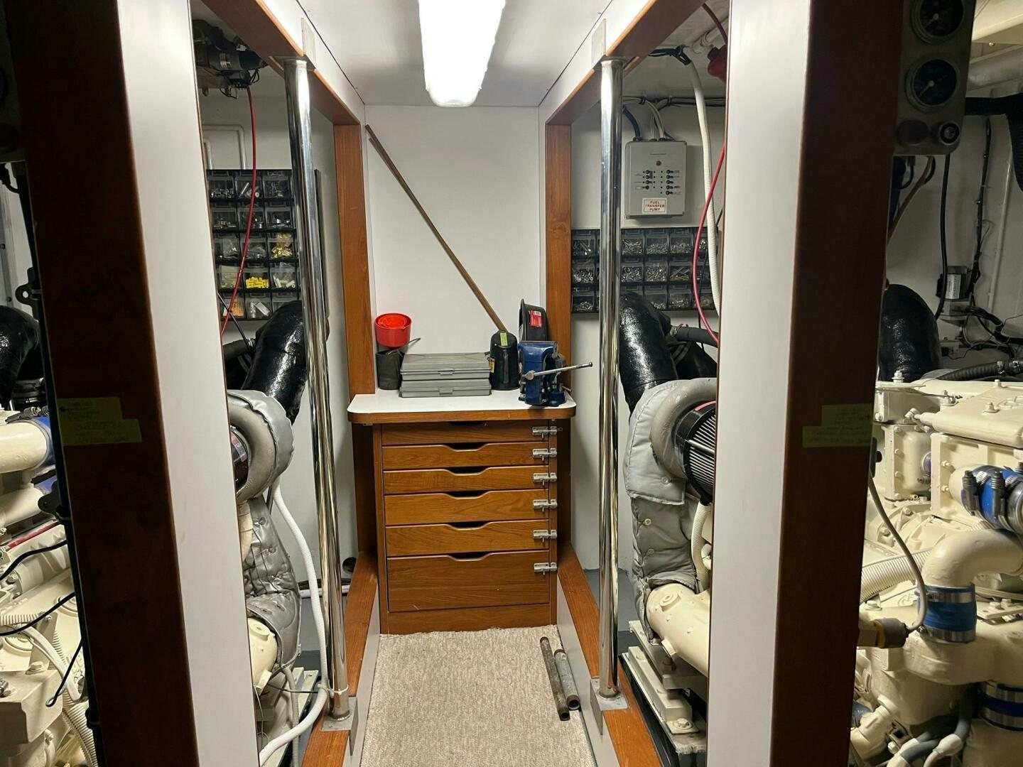 a room with a bed and a desk aboard LADY T Yacht for Sale