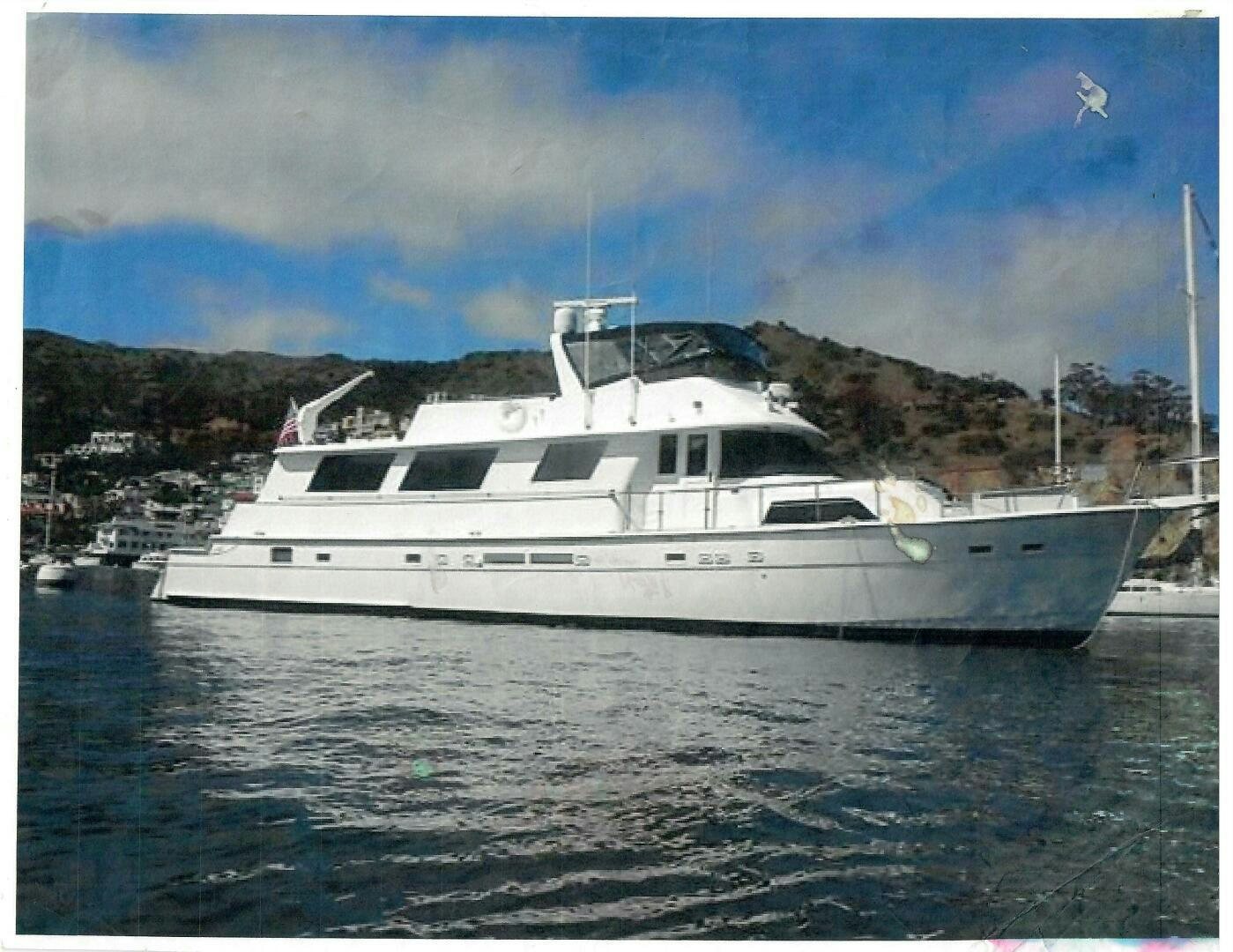 a white yacht in the water aboard LADY T Yacht for Sale