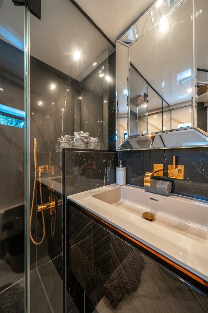 a bathroom with a sink and a mirror aboard SECOND CHANCE Yacht for Sale
