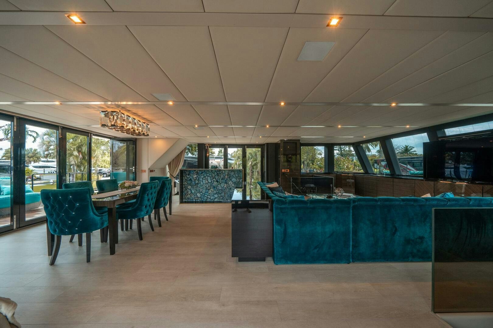 a room with blue chairs and tables aboard SECOND CHANCE Yacht for Sale