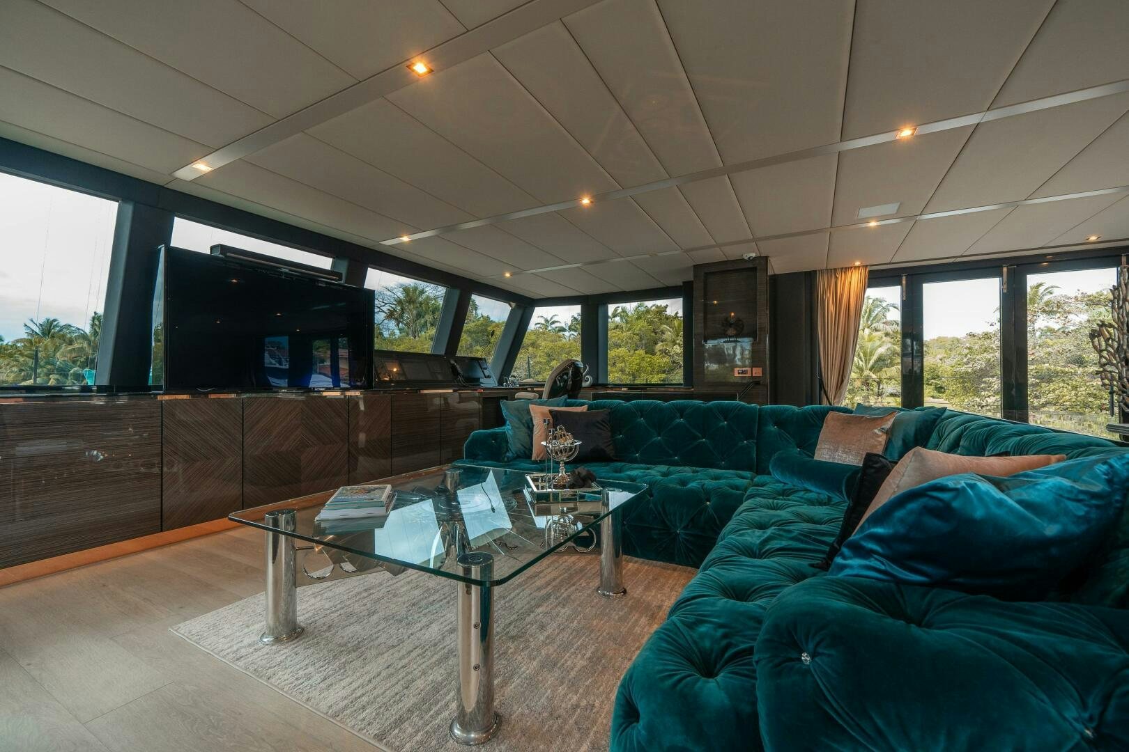 a living room with a large glass table and a large window aboard SECOND CHANCE Yacht for Sale