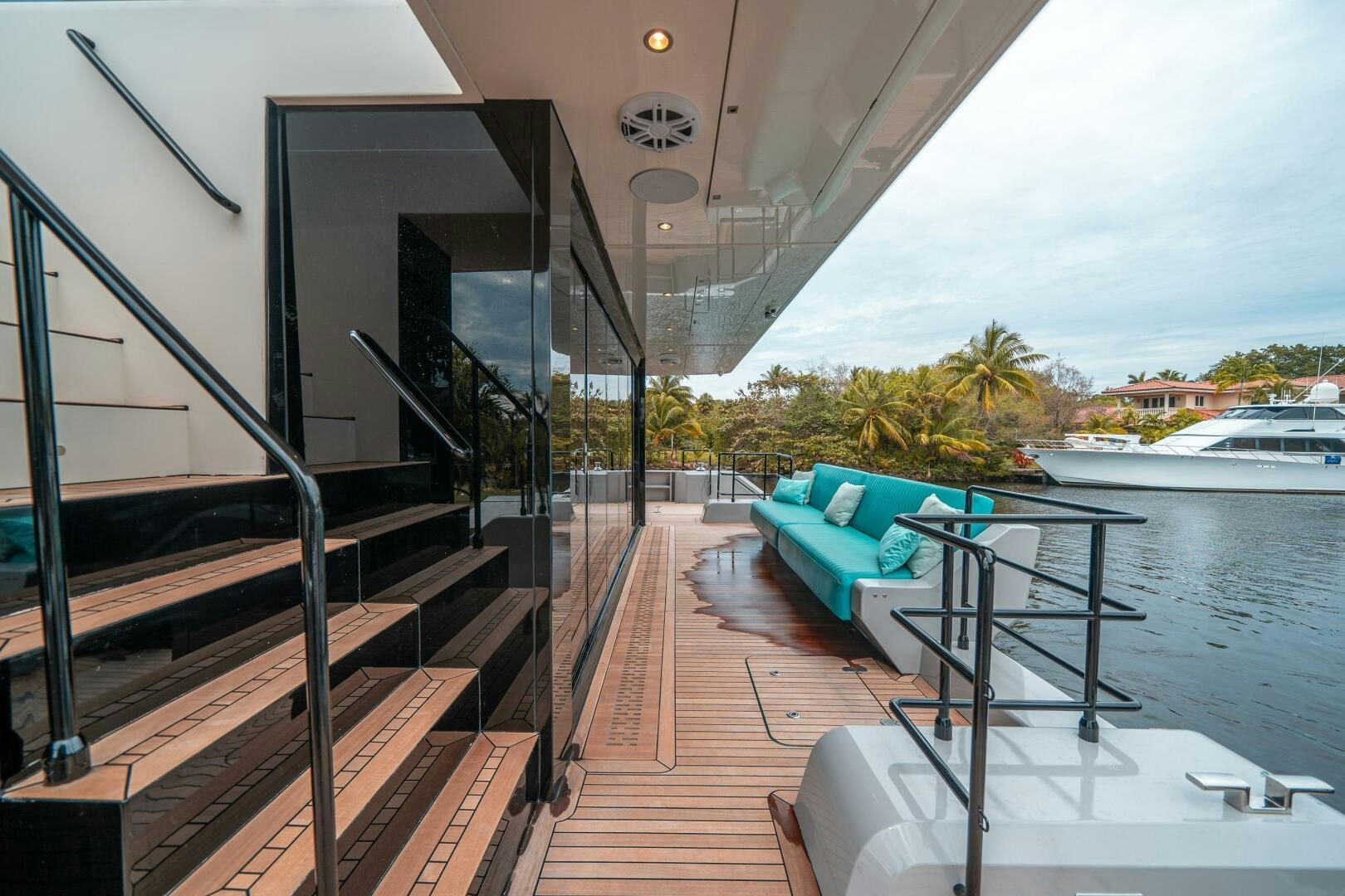 a balcony with a table and chairs on it aboard SECOND CHANCE Yacht for Sale