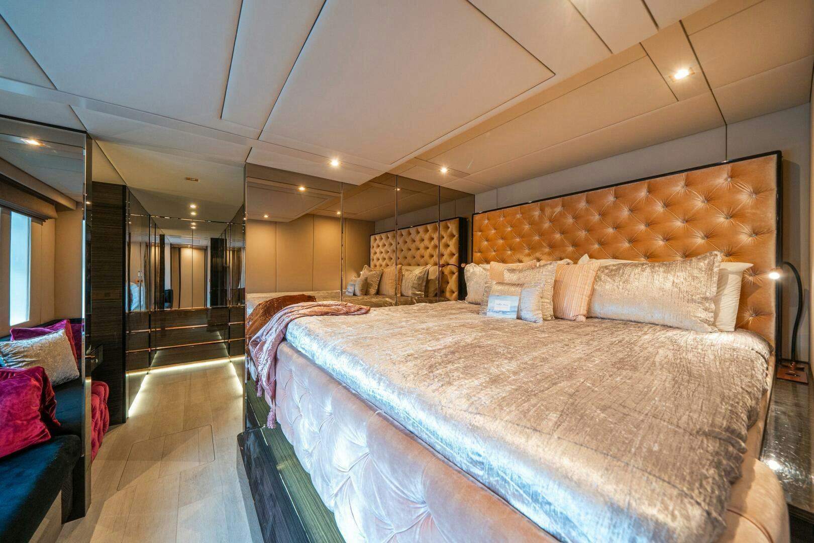 a bedroom with a bed and a chair aboard SECOND CHANCE Yacht for Sale