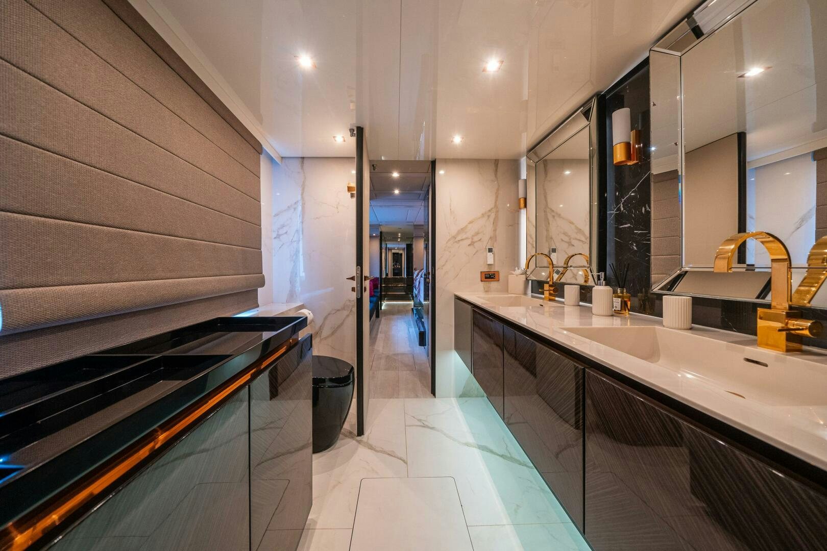 a bathroom with a countertop sink and a large mirror aboard SECOND CHANCE Yacht for Sale