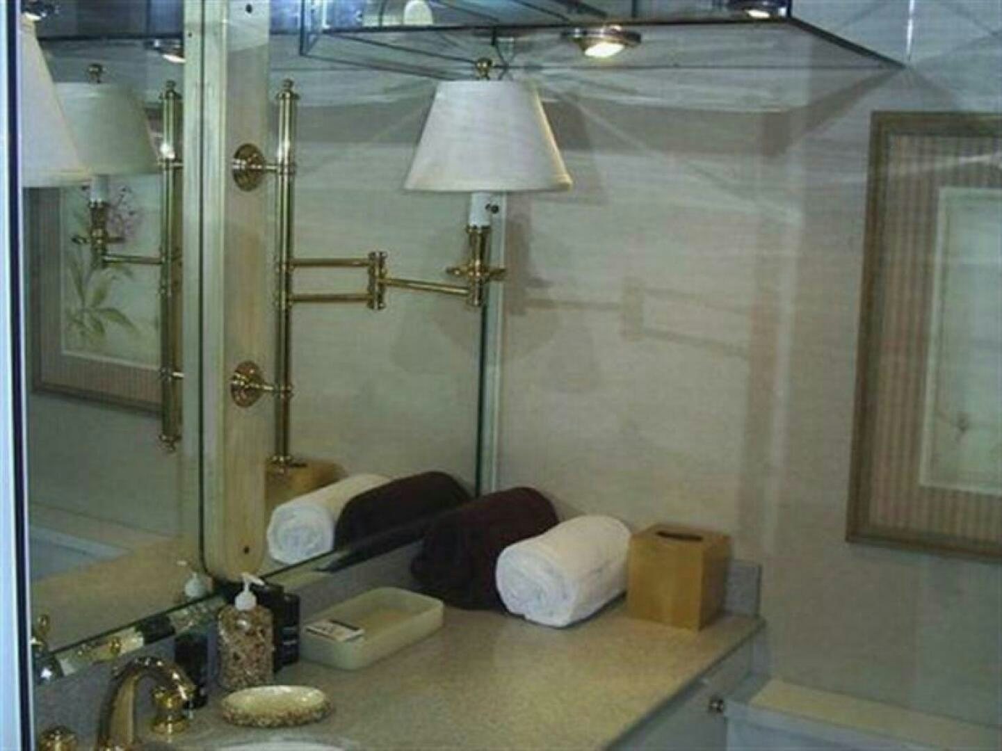 a bathroom with a large mirror aboard THE BEST DAY Yacht for Sale