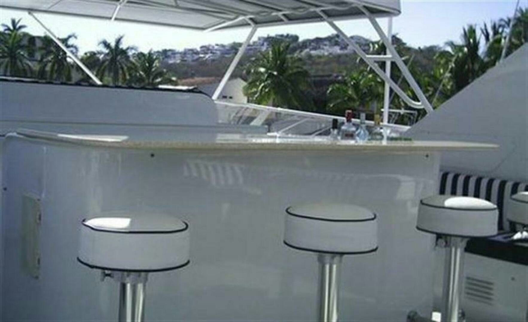 a group of stools on a deck aboard THE BEST DAY Yacht for Sale