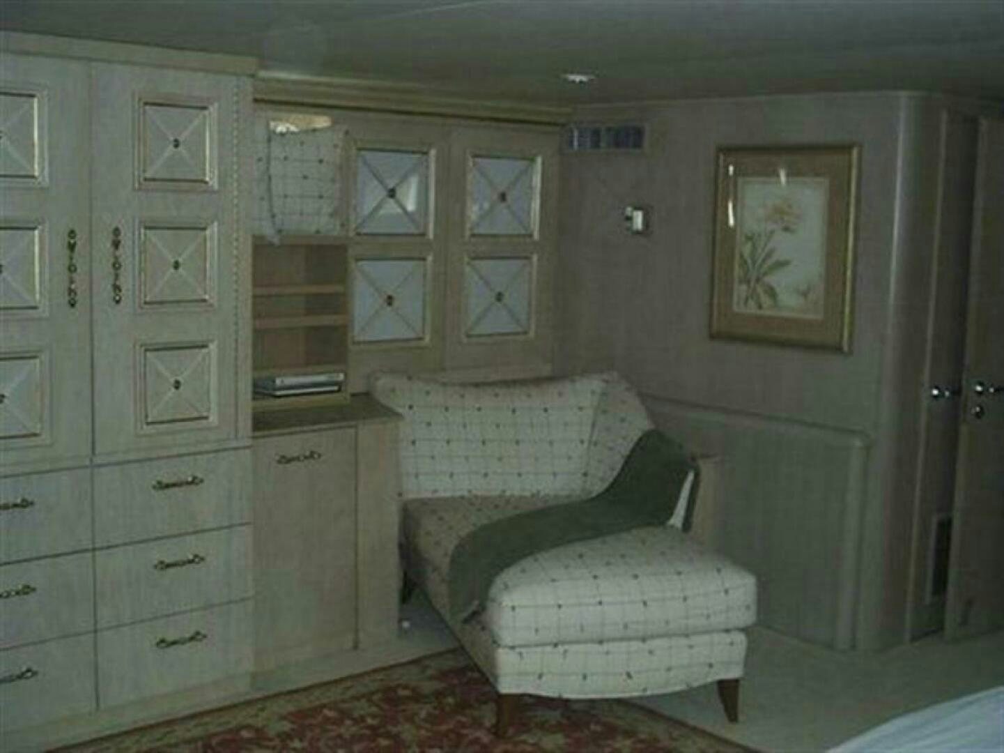 a room with a couch and a chair aboard THE BEST DAY Yacht for Sale