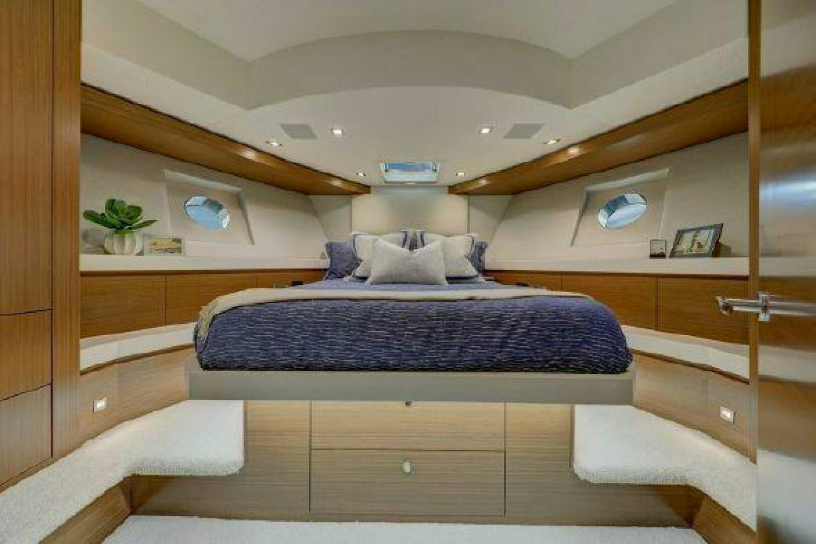 a bed in a room aboard 75 HATTERAS M75 / 2020 Yacht for Sale