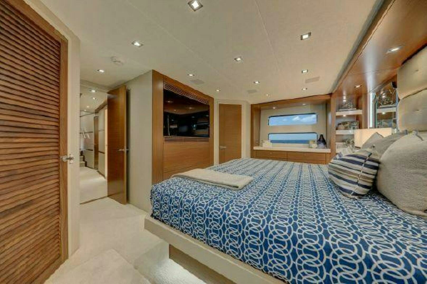 a bed in a room aboard 75 HATTERAS M75 / 2020 Yacht for Sale