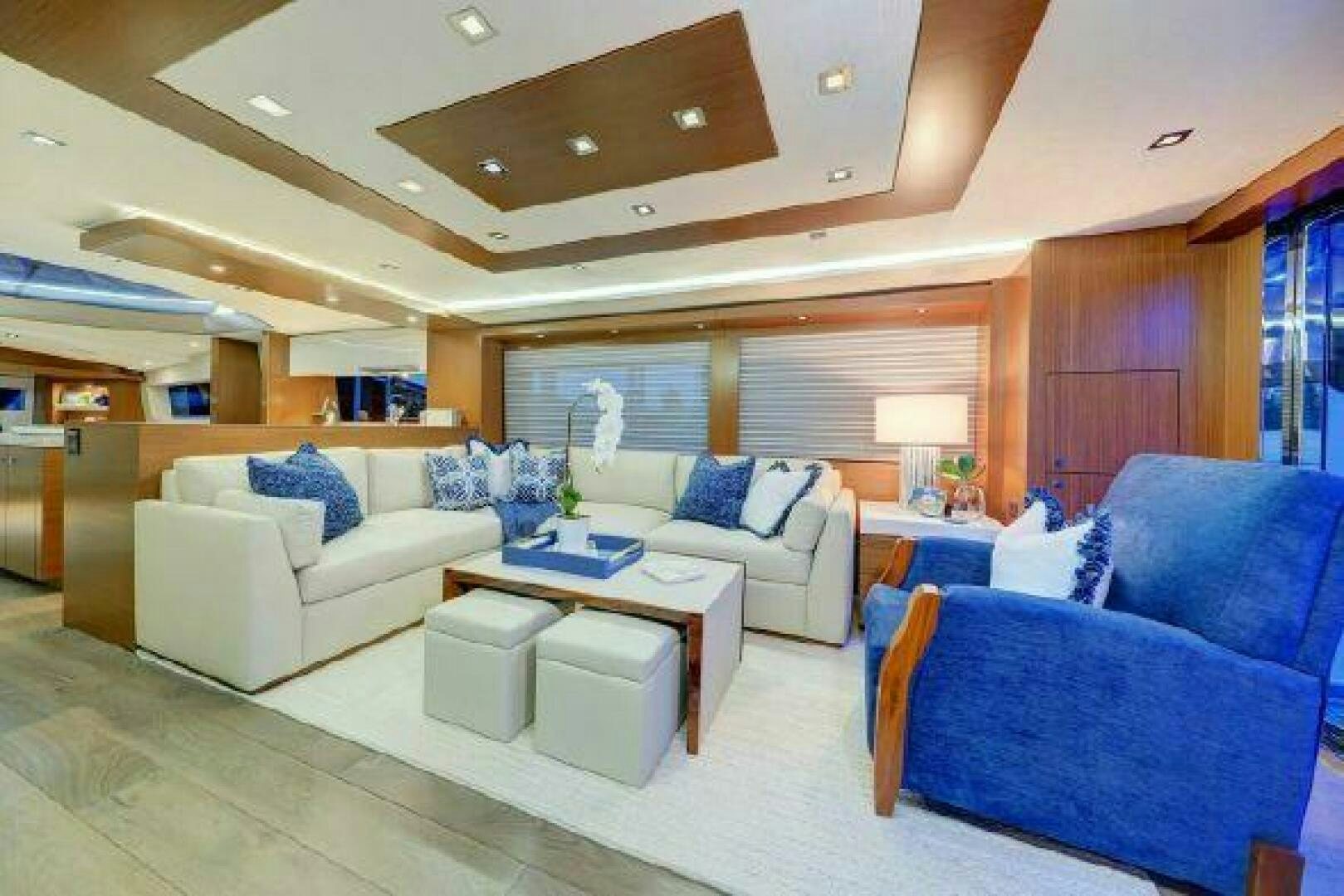 a living room with a couch and a table aboard 75 HATTERAS M75 / 2020 Yacht for Sale
