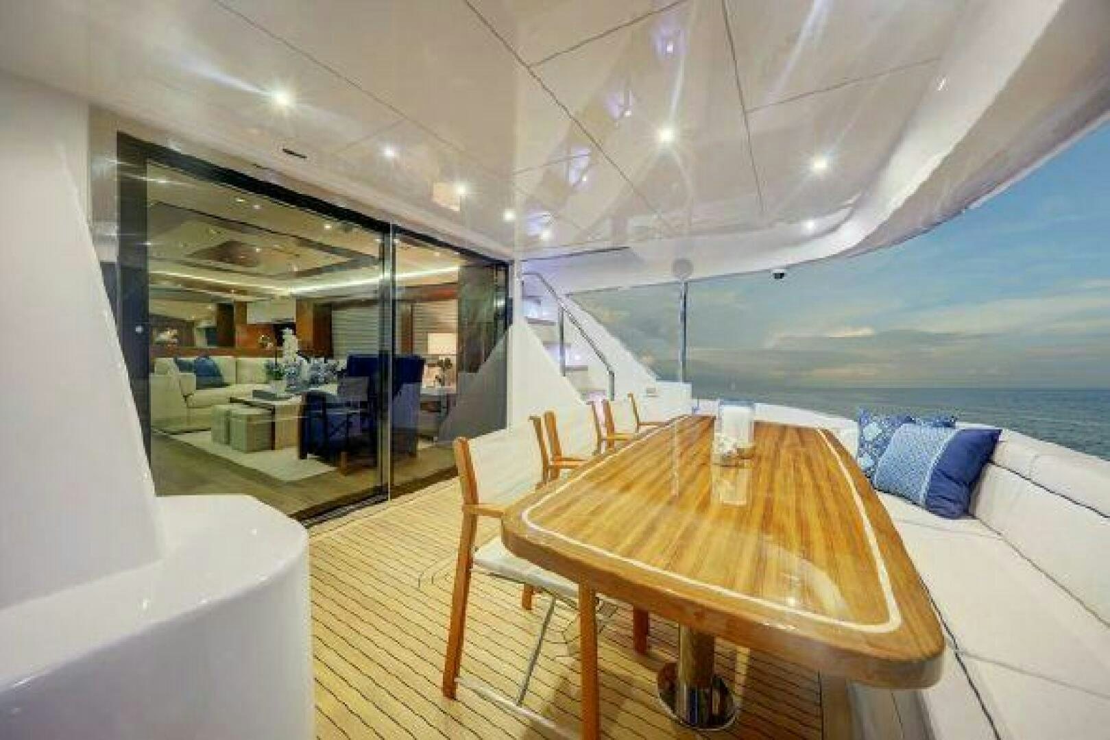 a room with a table and chairs aboard 75 HATTERAS M75 / 2020 Yacht for Sale