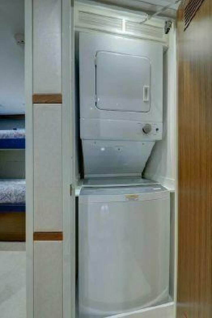 a white cabinet in a room aboard 75 HATTERAS M75 / 2020 Yacht for Sale