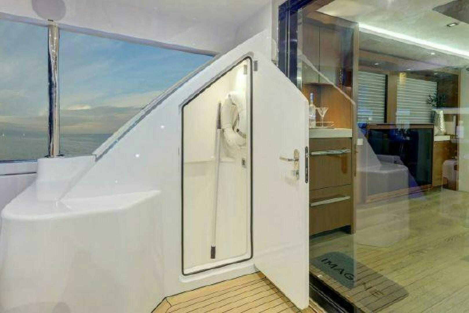 a large white door in a room aboard 75 HATTERAS M75 / 2020 Yacht for Sale