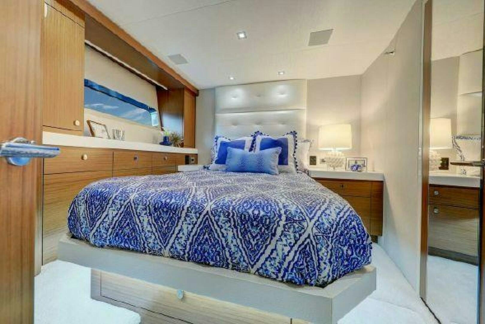 a bed in a room aboard 75 HATTERAS M75 / 2020 Yacht for Sale