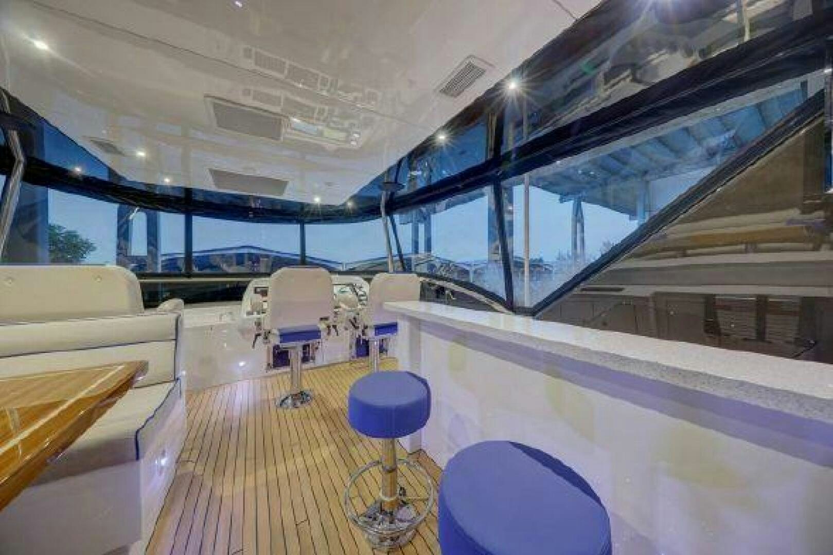 inside of a building with a wood floor and a large window aboard 75 HATTERAS M75 / 2020 Yacht for Sale