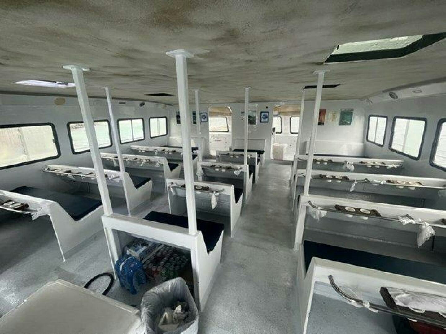 a room with bunk beds and a chair aboard EDGE 2 Yacht for Sale