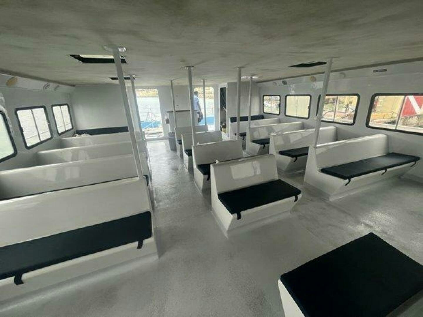 a room with a large window and a large bed aboard EDGE 2 Yacht for Sale