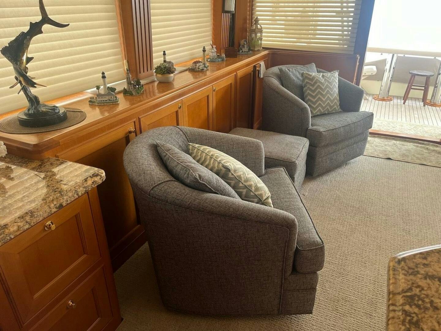 a living room with a couch and a piano aboard MOODY BLUE Yacht for Sale