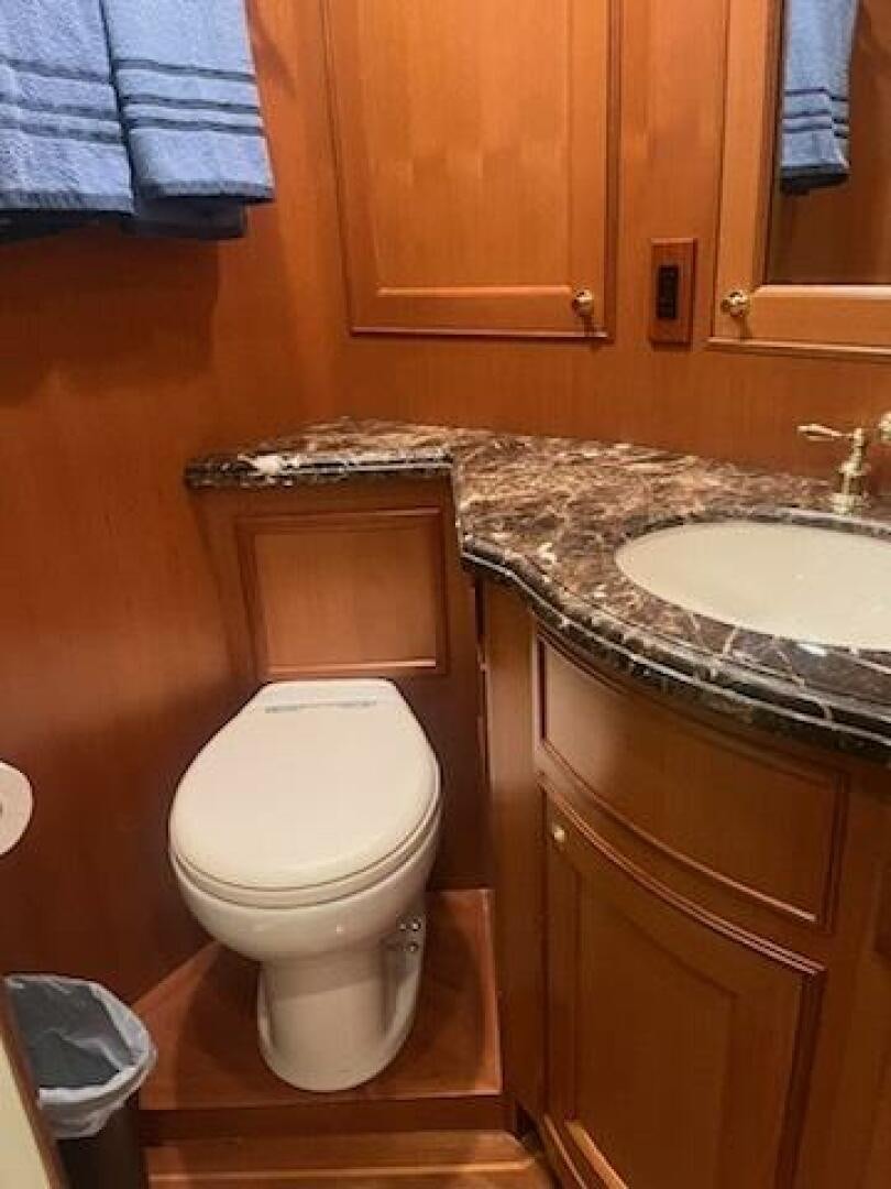 a bathroom with a toilet and sink aboard MOODY BLUE Yacht for Sale
