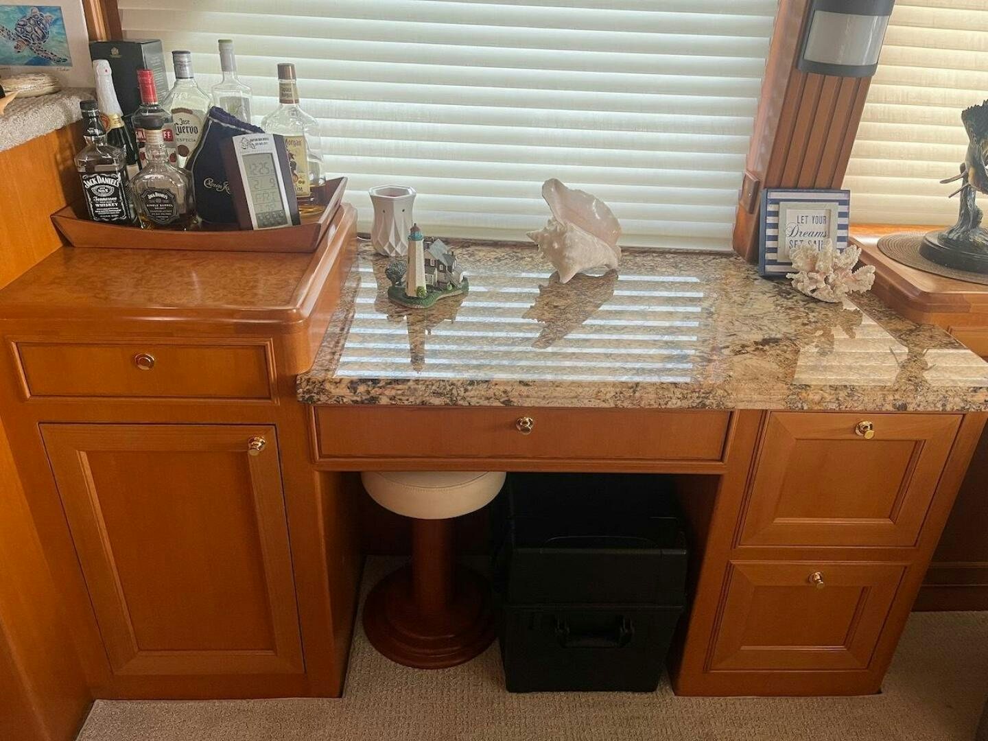 a bathroom with a countertop sink and cabinets aboard MOODY BLUE Yacht for Sale