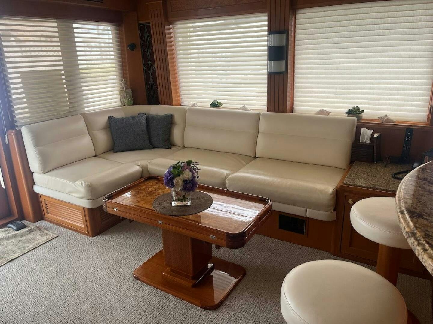 a living room with a couch and a coffee table aboard MOODY BLUE Yacht for Sale