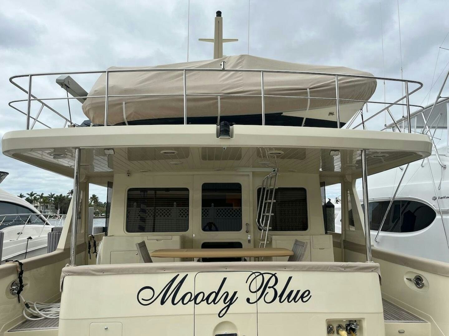 a boat with a sign on the front aboard MOODY BLUE Yacht for Sale