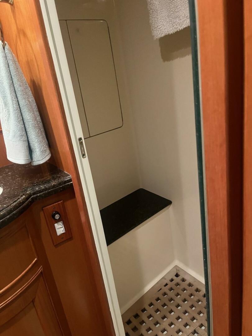 a door with a mirror above it aboard MOODY BLUE Yacht for Sale