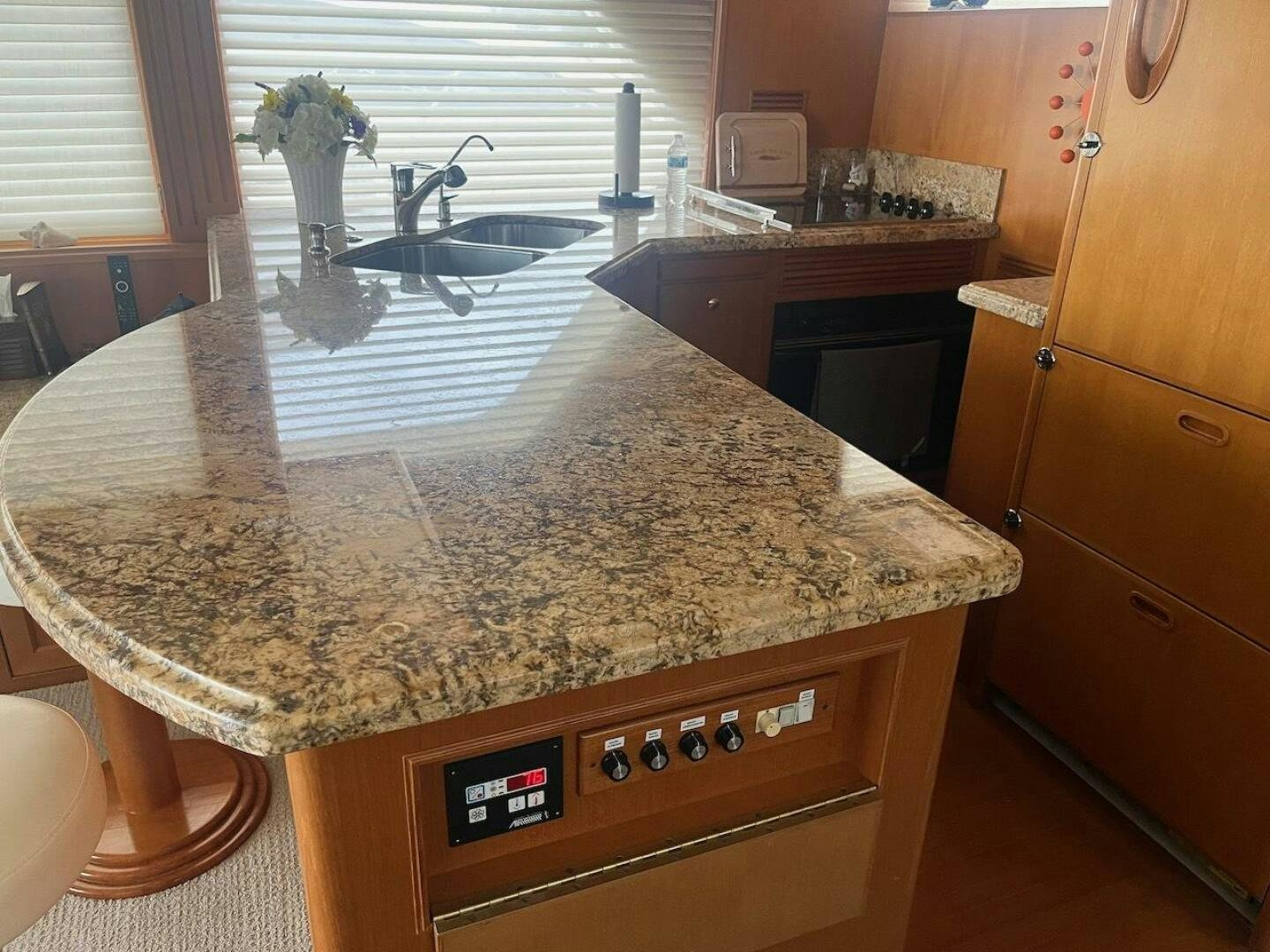 a kitchen with a marble counter top aboard MOODY BLUE Yacht for Sale