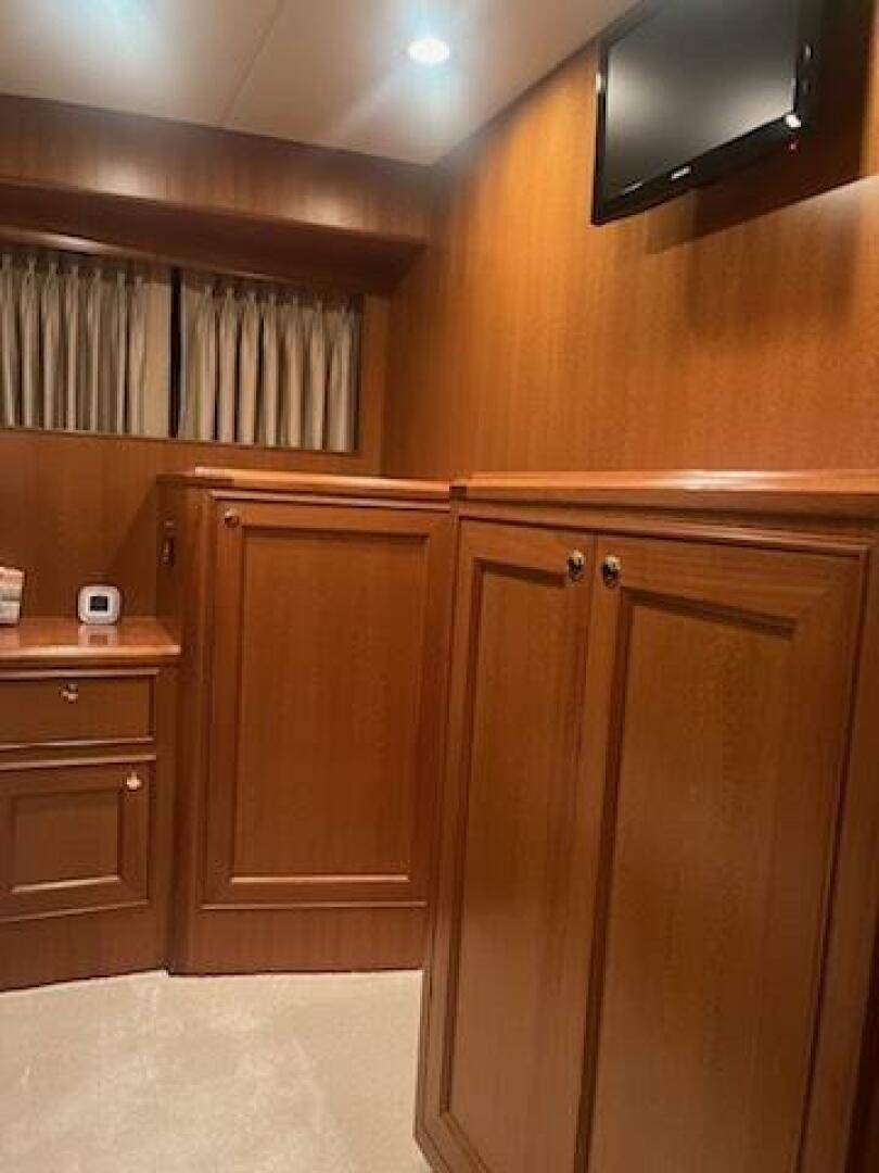 a kitchen with wooden cabinets aboard MOODY BLUE Yacht for Sale