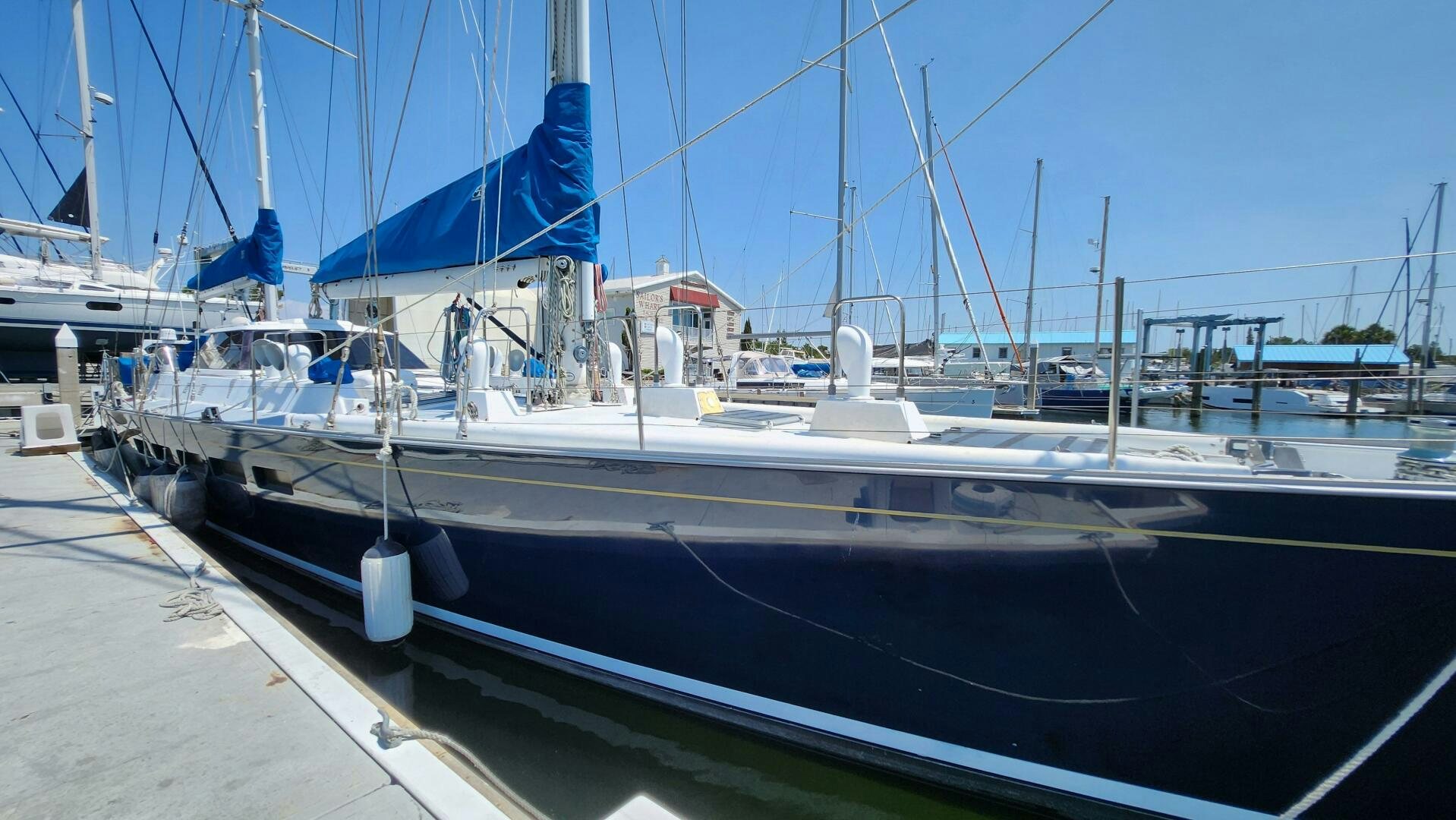 a boat docked at a pier aboard MAYA Yacht for Sale