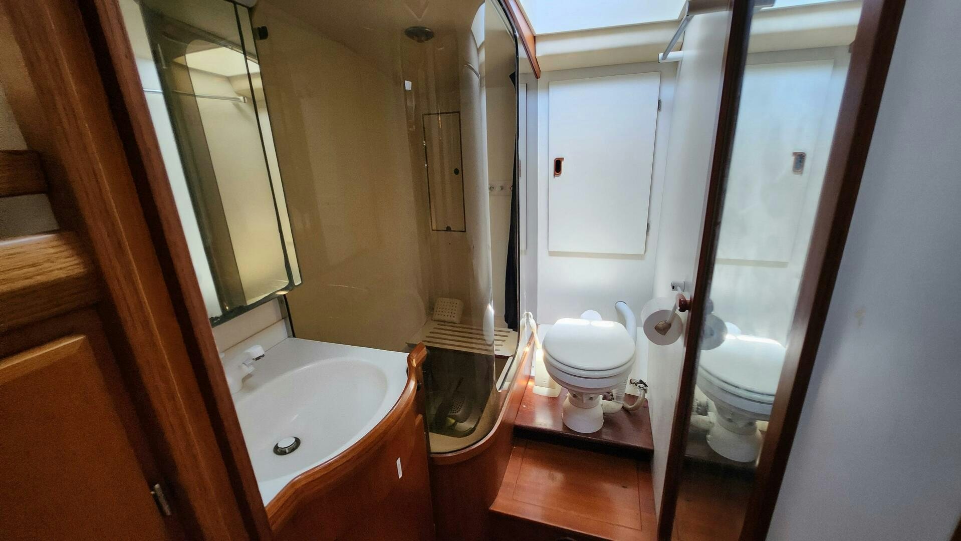 a bathroom with a toilet and sink aboard MAYA Yacht for Sale
