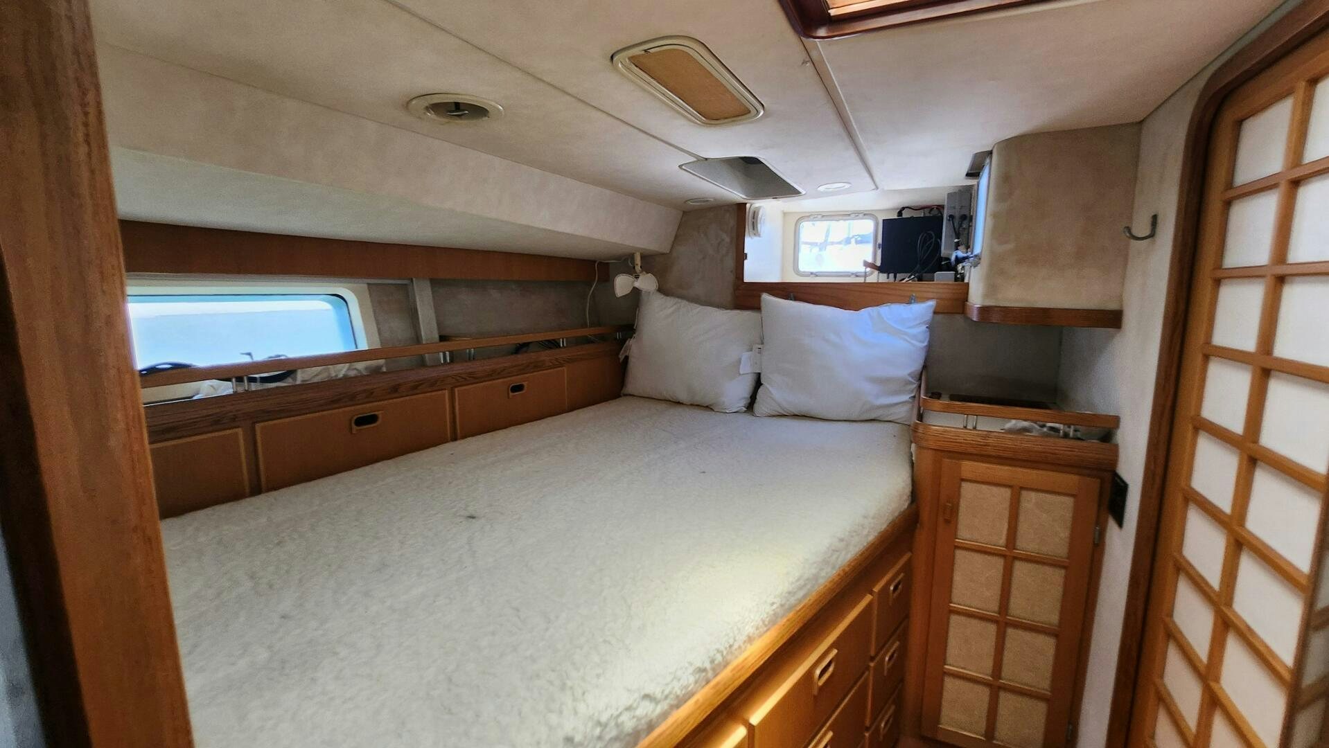 a bed in a room aboard MAYA Yacht for Sale