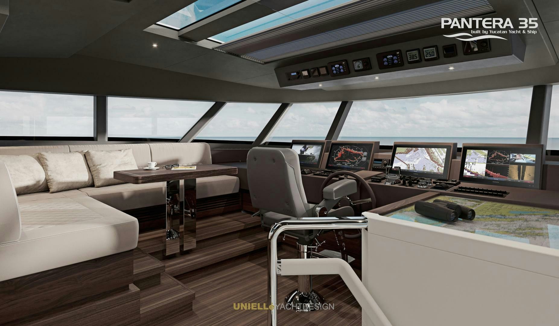 a room with a couch and a table and chairs aboard PANTERA 35 Yacht for Sale