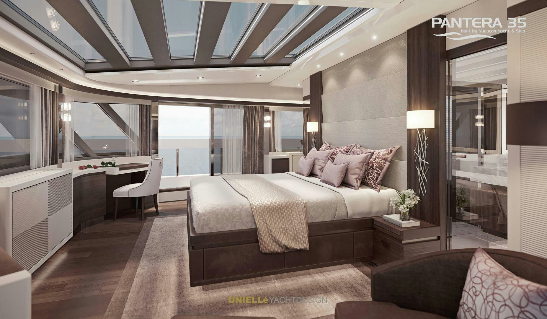a bedroom with a bed and a desk aboard PANTERA 35 Yacht for Sale